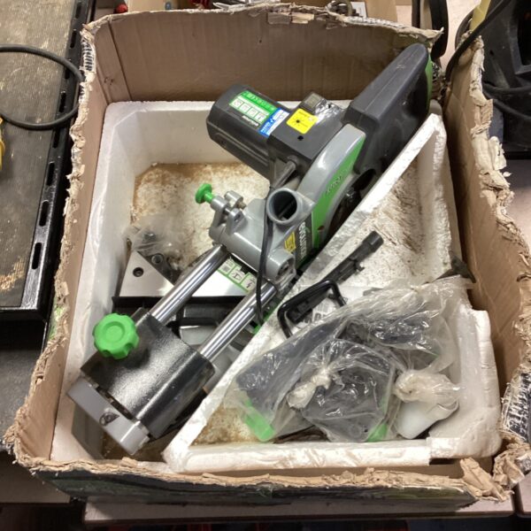 Used Makita router tool for woodworking, presented as-is for auction.
