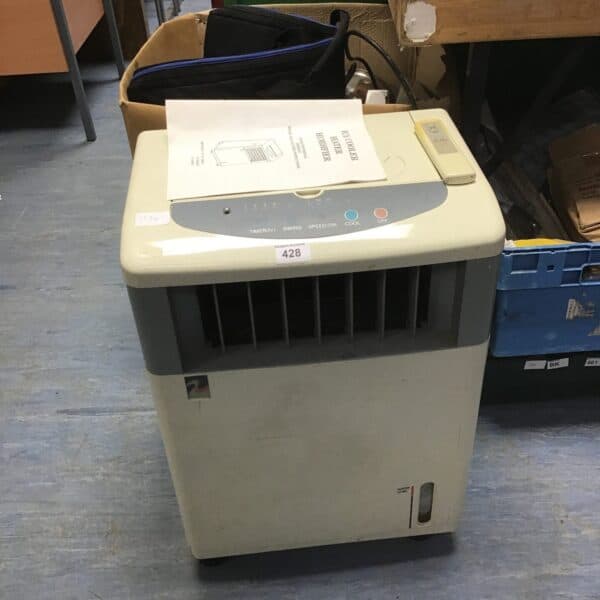 Vintage electric fan with metal cage and speed control switch.