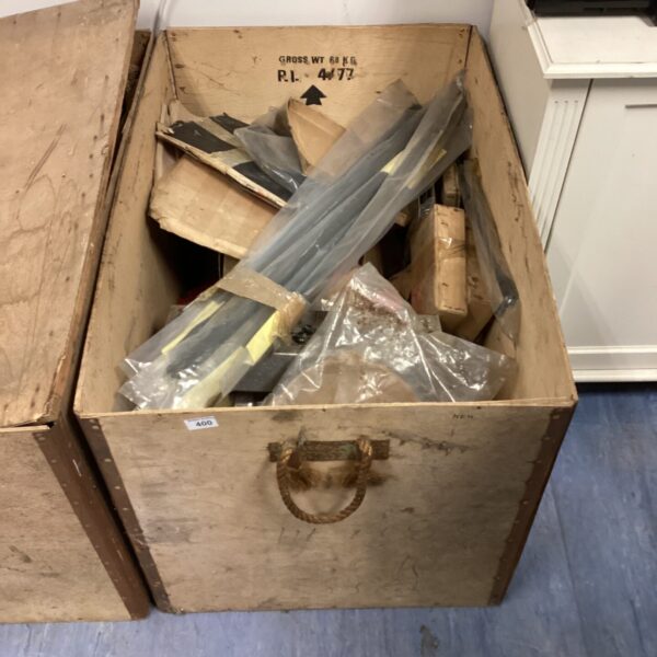 Box of vintage oak armchair fittings for restoration.
