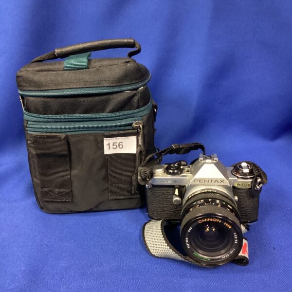 Vintage Pentax camera with lens, ideal for film photography collectors.