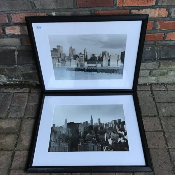 Vintage brass picture frame displaying a classic cityscape photograph.