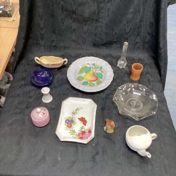Antique porcelain collection featuring vintage teacups and decorative plates.