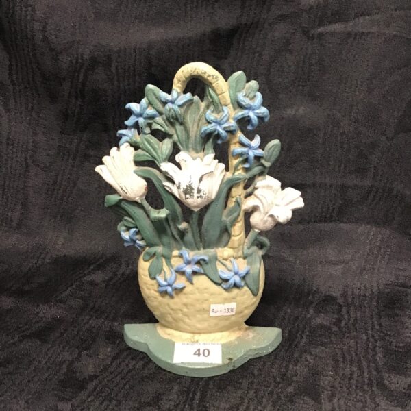 Vintage ceramic floral plant stand with white flowers.