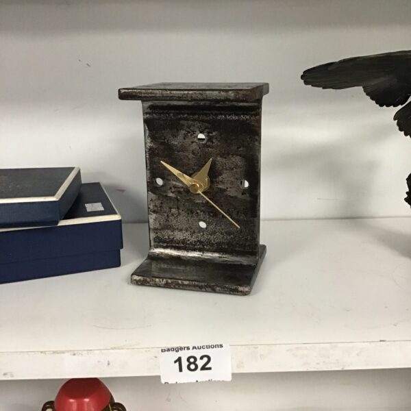 Vintage black marble mantel clock with gold hands.