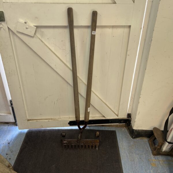 Vintage garden dibber with wooden handle and steel point.