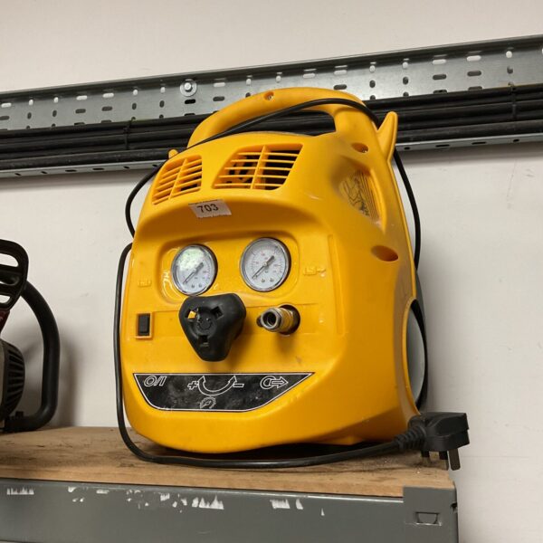 Yellow portable air compressor with pressure gauge.