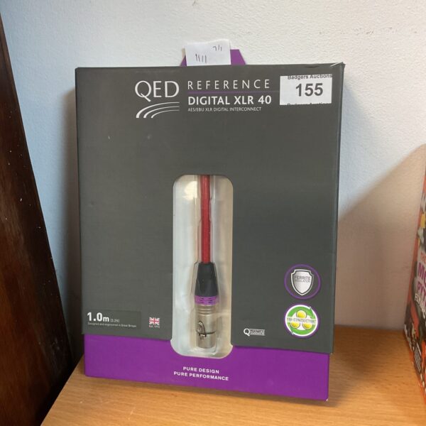 QED XLR cable displayed on a Georgian side table.