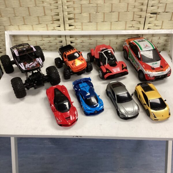 Diecast car lot featuring various model cars and toy vehicles.