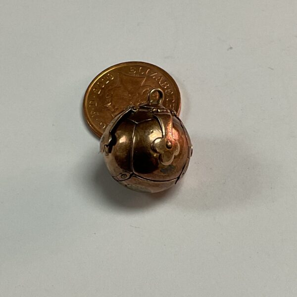 Vintage brass nutmeg grater, antique kitchen tool.
