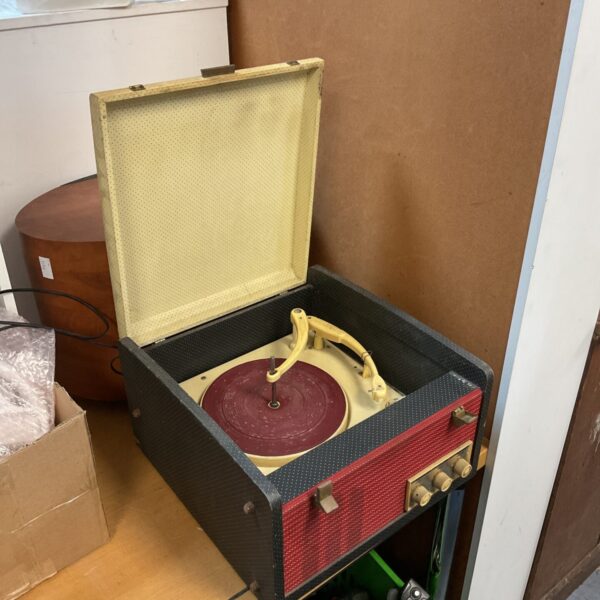 Vintage red and cream record player turntable.