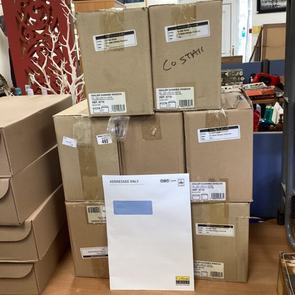 Stack of eight boxes of CoStar branded window envelopes.