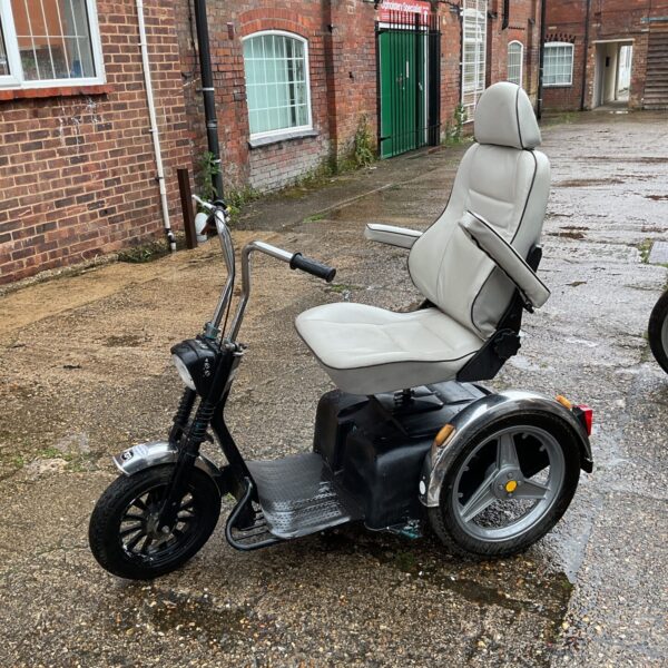 TGA Sportster SE trike mobility scooter shown outdoors.