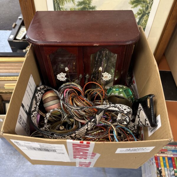 Assortment of vintage belts with various buckles and materials.