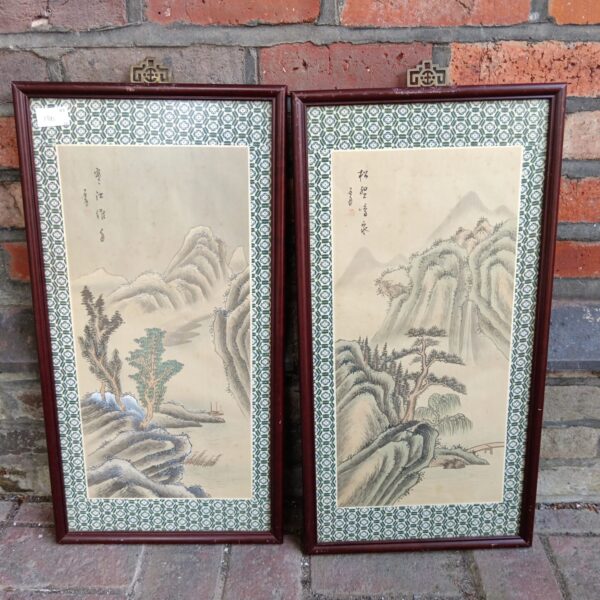Antique Chinese landscape painting pair with mountain scenery.