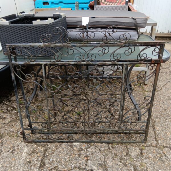 Ornate wrought iron gates for driveway or garden entrance.