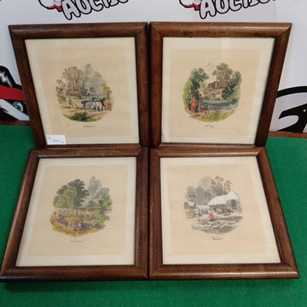 Set of four framed seasons prints in wooden frames.