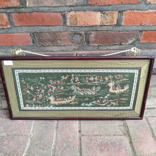 Vintage Chinese dragon boat tapestry with detailed embroidery.