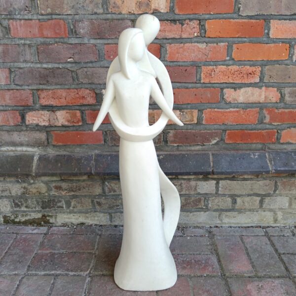 Modern garden statue depicting abstract flowing forms, Enigma Infinite Love.