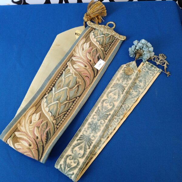 Pair of vintage bell pulls with brass ends and floral fabric.