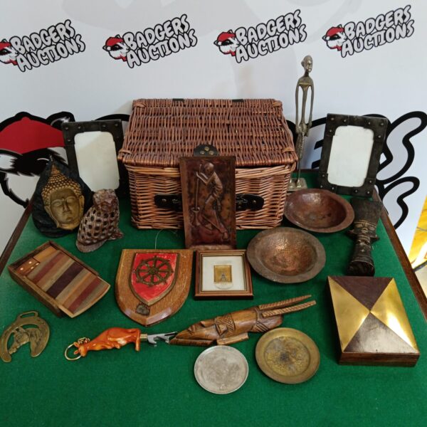 Woven basket filled with a mixed lot of vintage collectables.