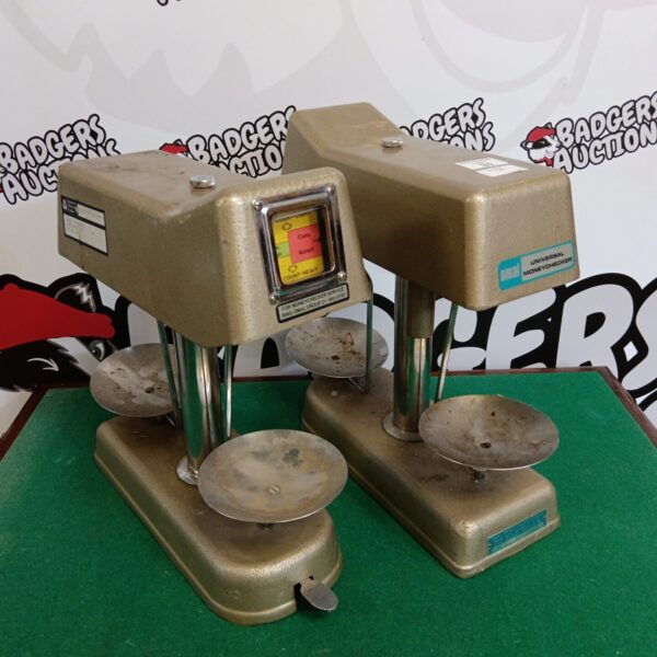 Vintage Omal Universal money checker, antique coin counting device.