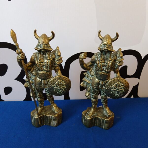 Pair of vintage brass Viking statues with shields and spears.