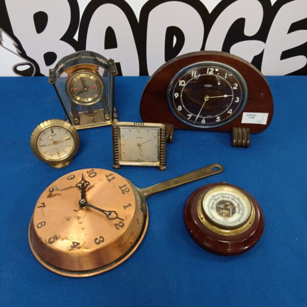 Vintage clock collection featuring Metamec and Barigo instruments.