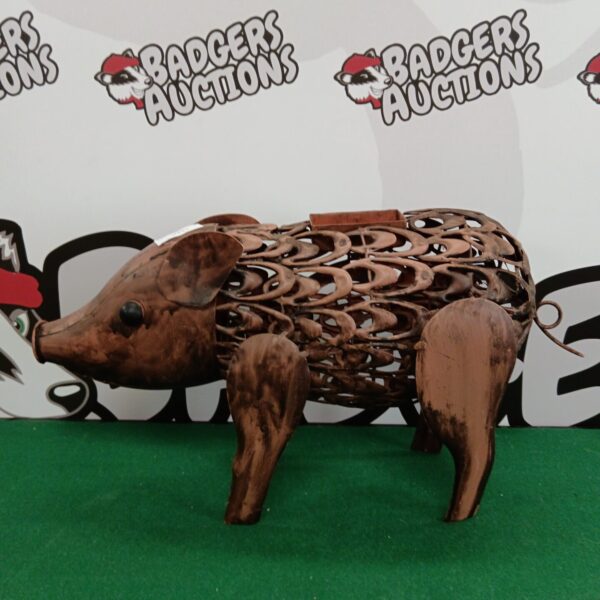 Detailed metal garden pig sculpture for outdoor decoration.