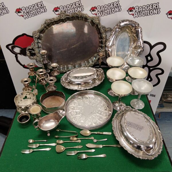 Vintage silver plate lot featuring a serving tray and cutlery.