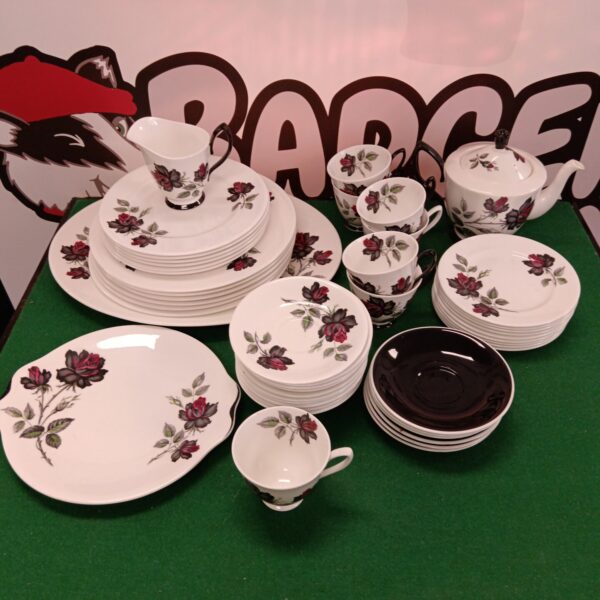 Royal Albert Masquerade china set with plates, teacups, and saucers.