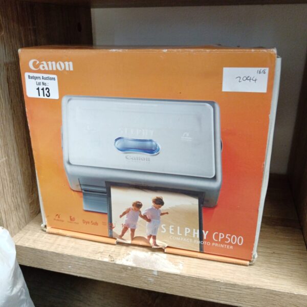 Canon Selphy CP500 compact photo printer in grey.