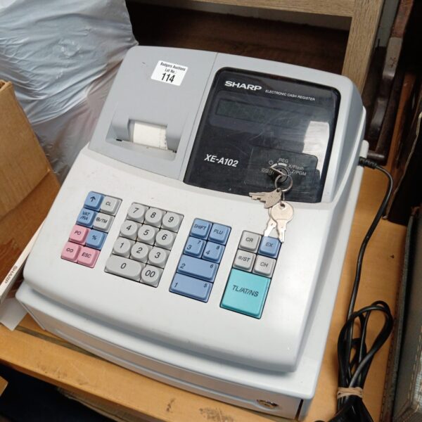 Vintage Sharp XE-A102 cash register in used condition.