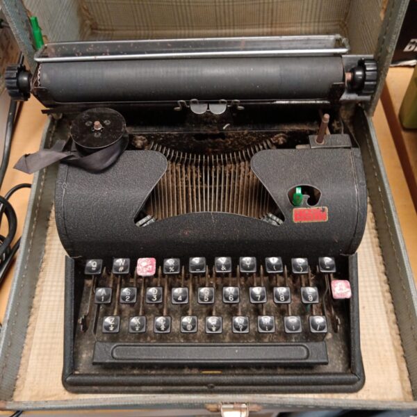 Close-up of a vintage mechanical typewriter with keys.