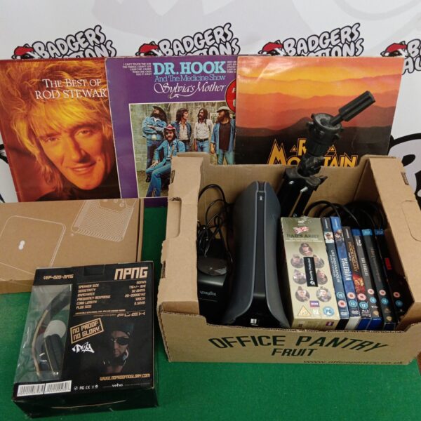 Mixed lot of vinyl records, DVDs, and NPNG headphones for sale.