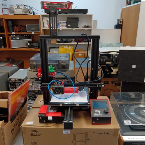 Creality Ender 3 Pro 3D printer in a workshop setting.