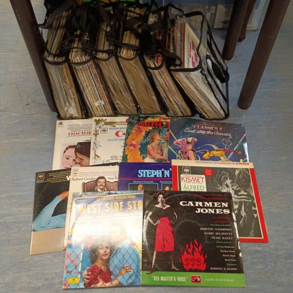 Vintage vinyl records lot with colourful album covers.