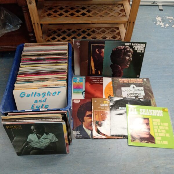Large lot of vintage vinyl records for collectors and music lovers.