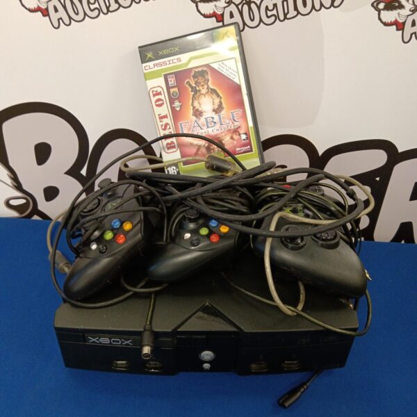 Front view of original Microsoft Xbox gaming console with controllers.