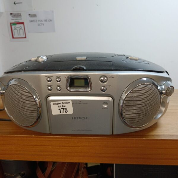 Vintage Hitachi boombox radio with CD and cassette player.