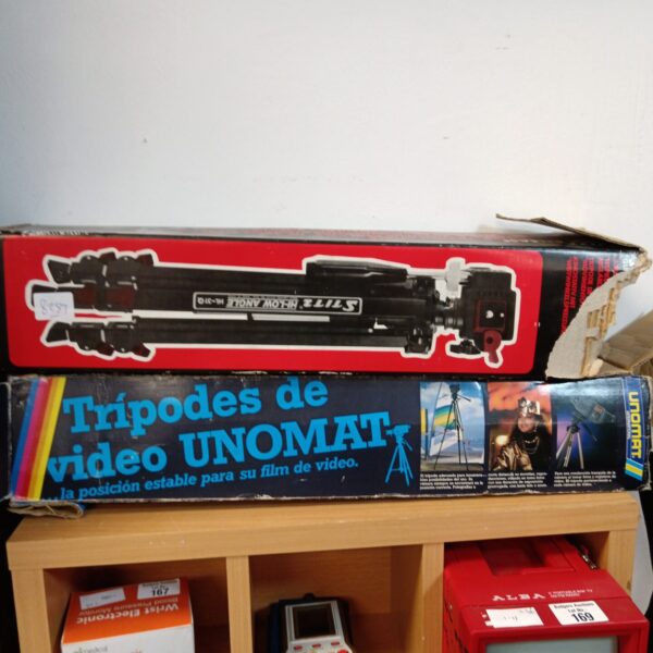 Vintage Unomat camera tripod in original packaging.