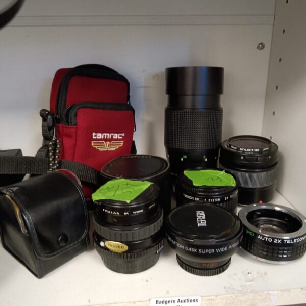 Vintage camera lens lot including Tamron and Minolta lenses.