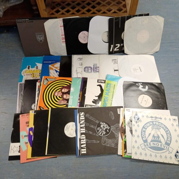 Crate filled with a large lot of 12 inch vinyl records.