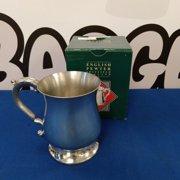 Vintage English pewter tankard with a classic design.