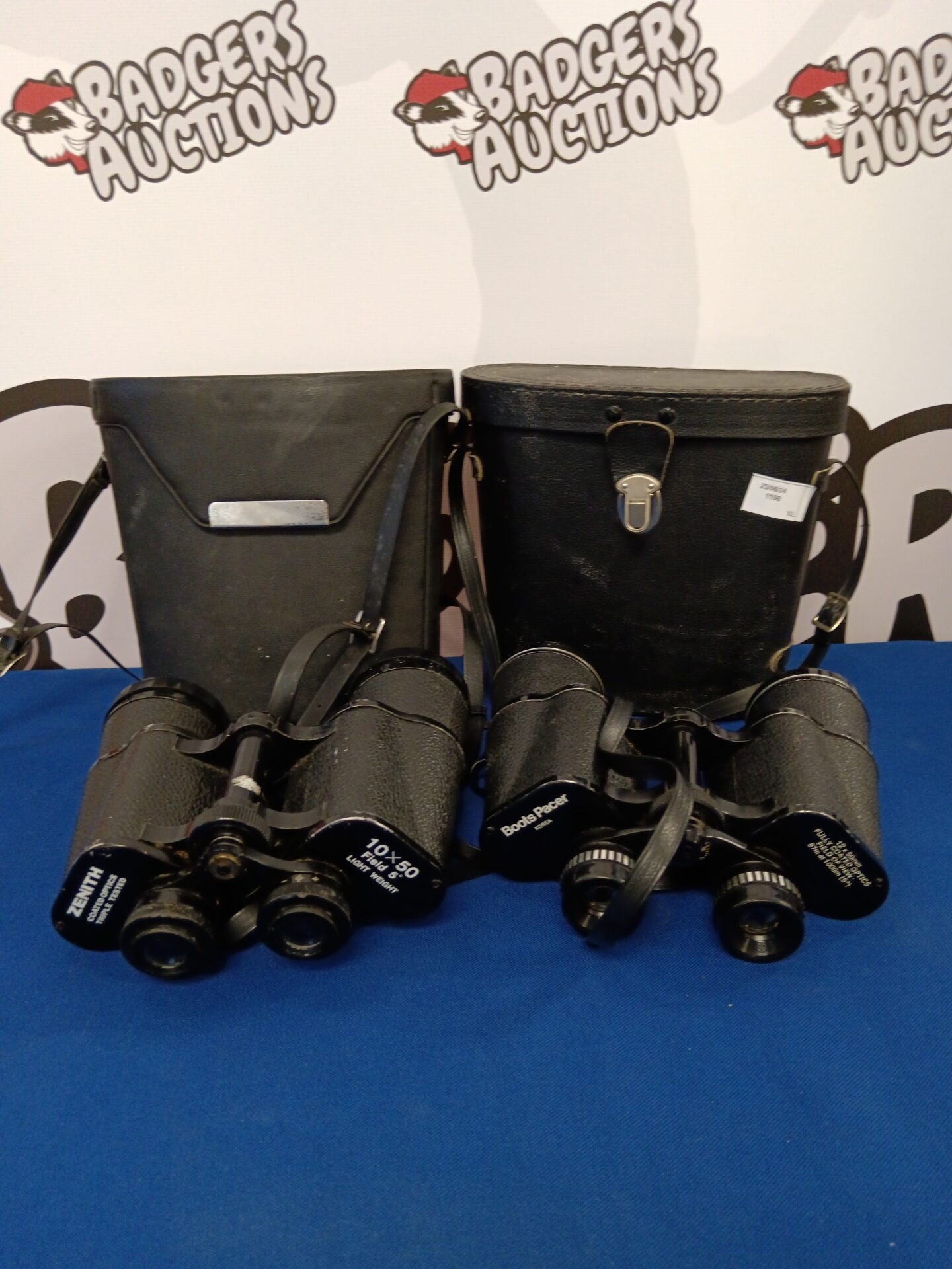 210 Two pairs of binoculars Inc zenith & boots