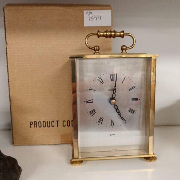 Vintage brass Acctim carriage clock with Roman numerals.