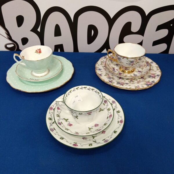 Vintage Royal Albert teacup trio with a green floral pattern.