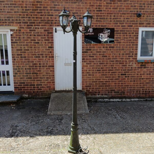 Vintage tri head driveway lamp with three frosted glass shades.