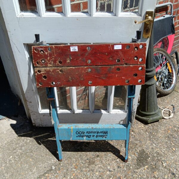 Vintage Black & Decker Workmate 400 workbench in a garden setting.