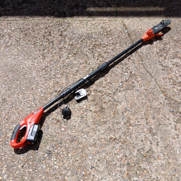 Black & Decker cordless polesaw for garden pruning and tree maintenance.