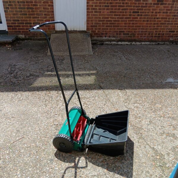 Bosch AHM 48 push mower in a garden setting.